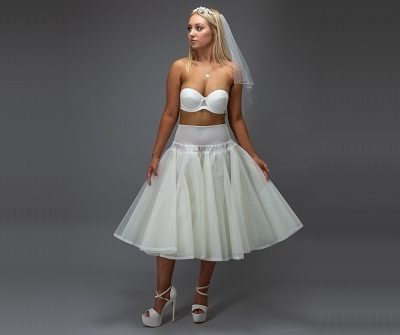 bride in a white short petticoat with veil and heels